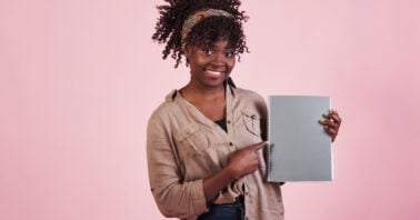 Studying 2026 job trends; young woman holding a planner; starting the year after January rush